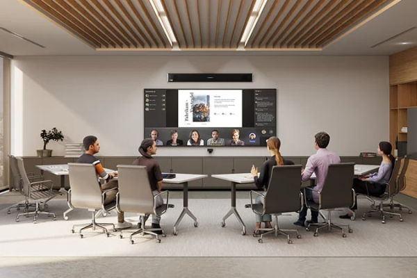 Small corporate team having video conference with another small team in a boardroom