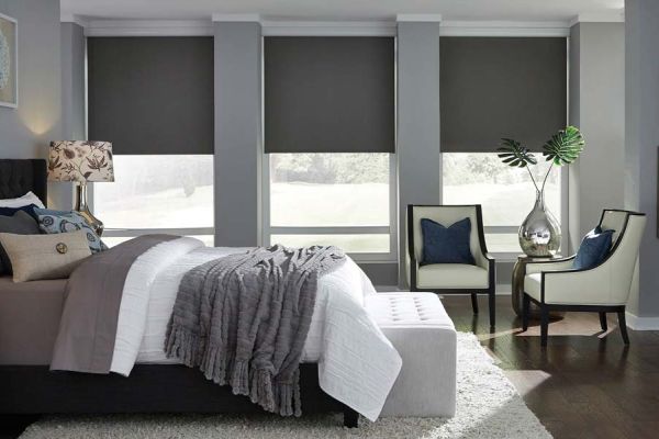 Blackout shades by Lutron in a cool grey bedroom